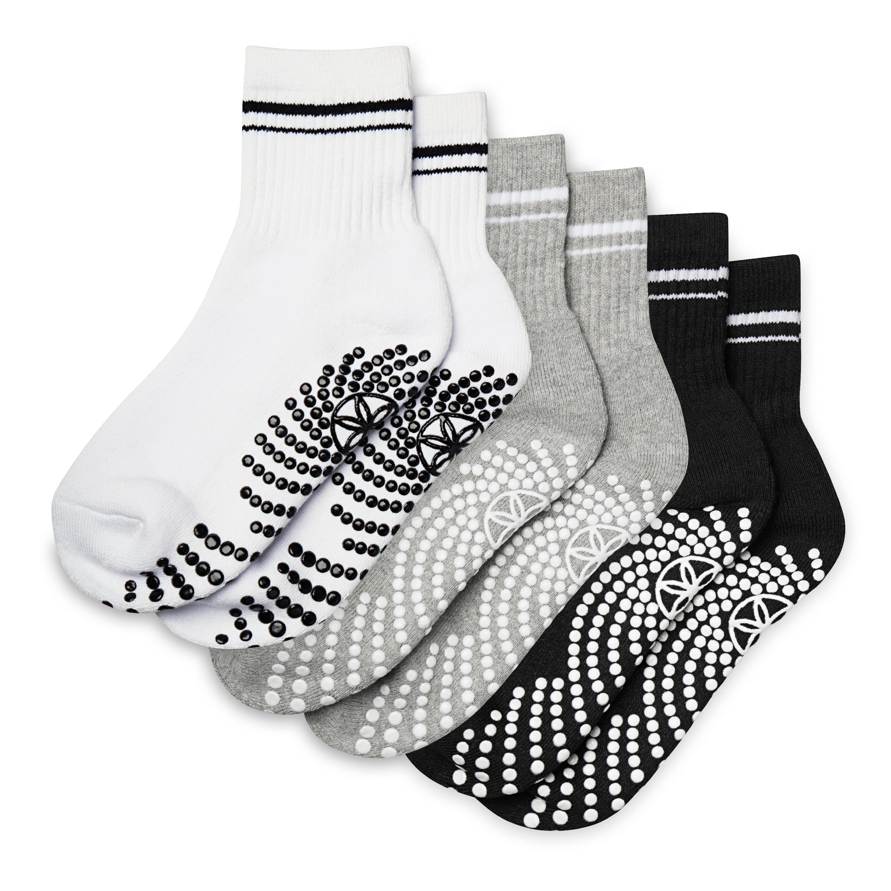 Set of five pairs of socks with non-slip patterns on a white background